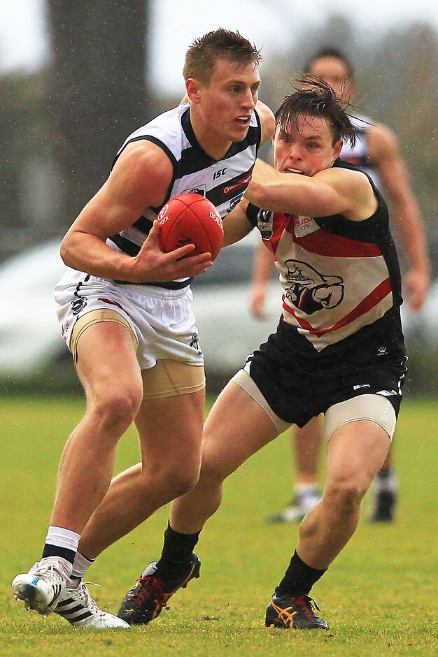 VFL 2015 Rd 16 - Frankston v Geelong MELBOURNE, AUSTRALIA - AUGUST 02: Jarrad Jansen of Geelong (L) is tackled by Jordan Pollard of Frankston during the round 16 VFL match between Frankston and Geelong at Frankston Oval on August 2, 2015 in Melbourne, Australia. (Photo by Graham Denholm/AFL Media/Getty Images)